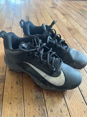Nike Youth Black Athletic Cleats with White Swoosh